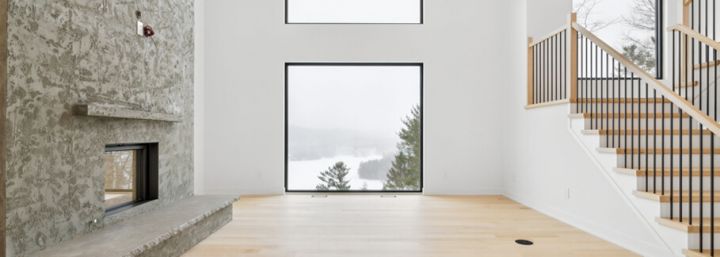 Salon d'une maison neuve à Val-des-monts, Construite par Exo.